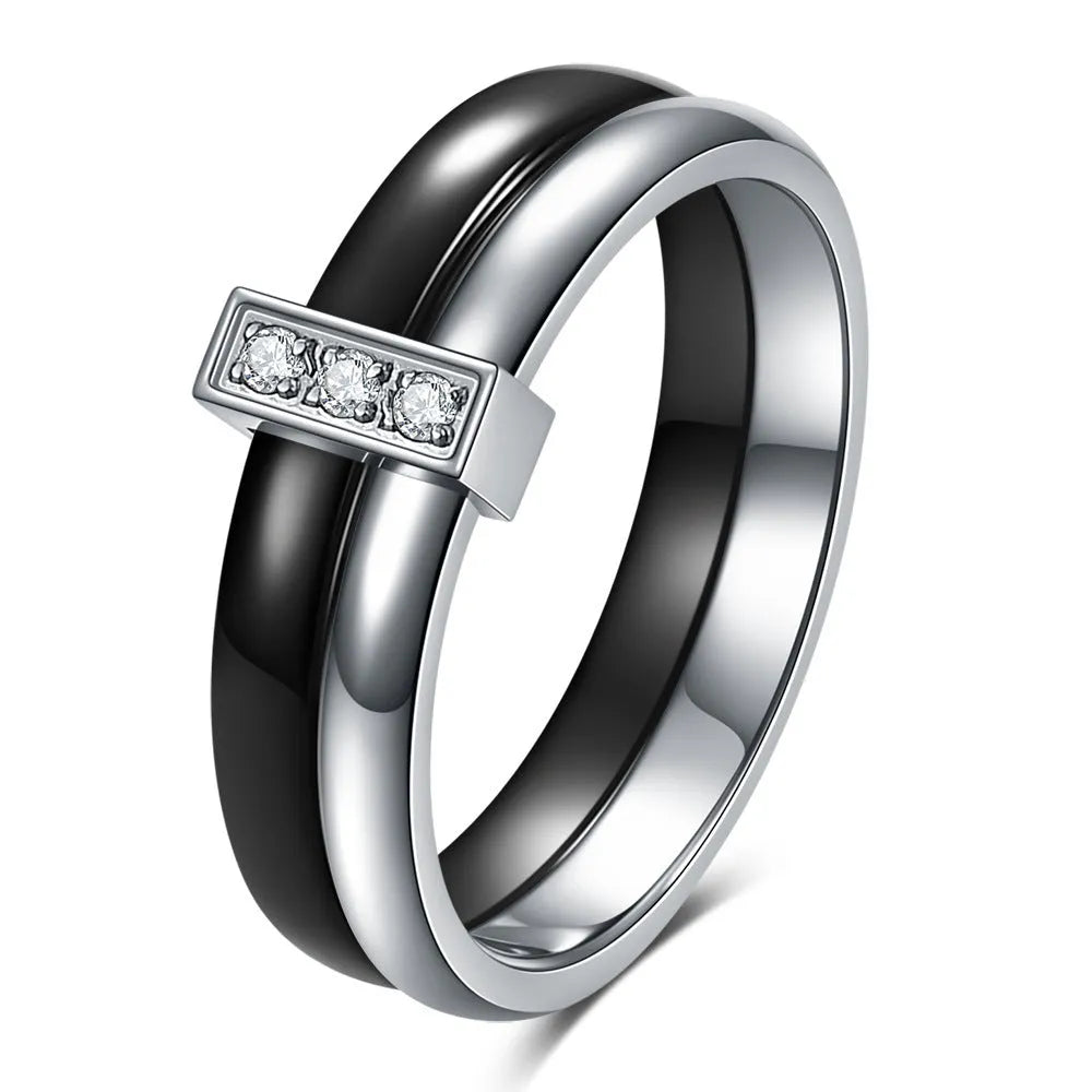 Geometric ceramic women's ring with glossy stitching and inlaid zirconium detail, shown in steel black.
