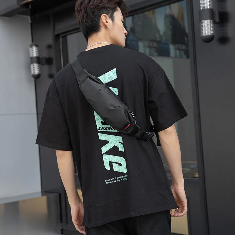 Black Oxford cloth crossbody waist pack with zip closure, shown with internal phone and ID pockets visible.