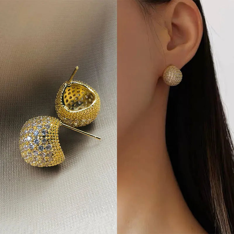 Geometric drop earrings with full diamond pave on golden spherical components in gold and white colour options