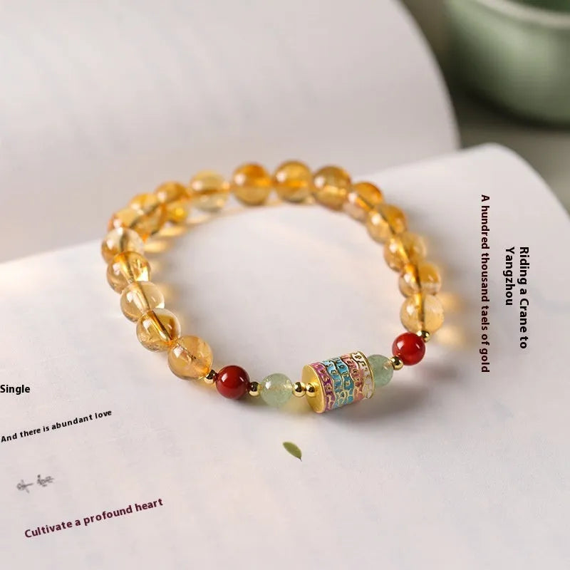 Yellow citrine bracelet with prayer wheel centrepiece and 8mm round beads