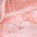 Silver cherry fruit pendant necklace on an adjustable snake bone chain for women.