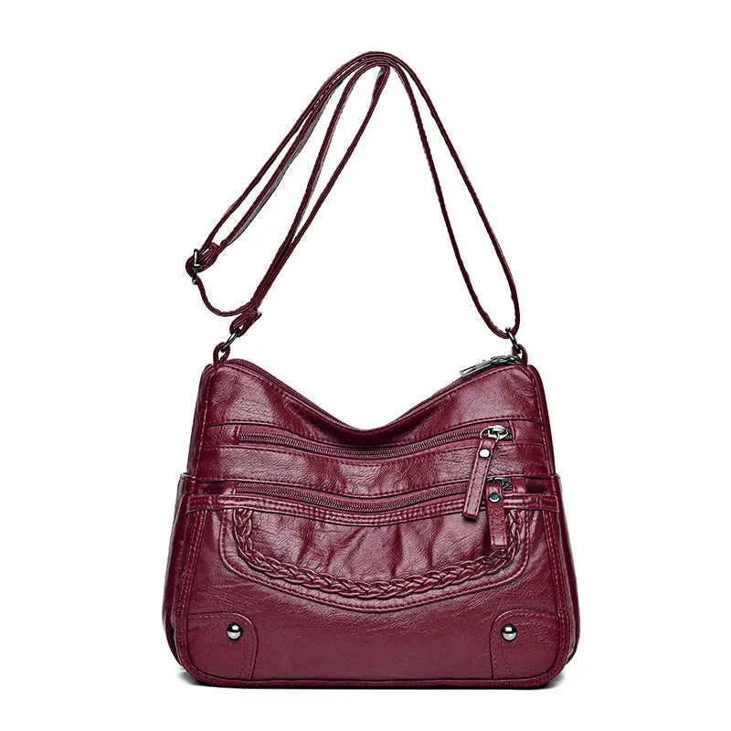 Soft PU messenger bag in horizontal square shape with multiple pockets and sewing thread detailing