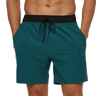 Men's blue stitching waist athletic shorts with a drawstring and zippered side pocket.