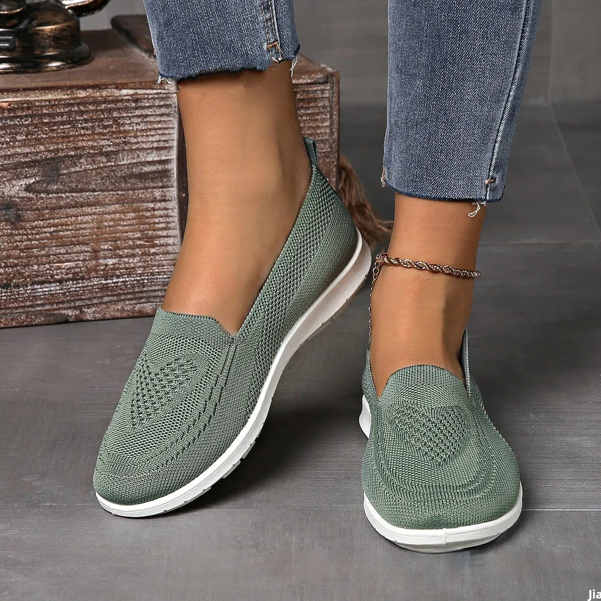 Plus size women's low-top leisure cloth shoes in beige with a heart-shaped pattern and flat sole.