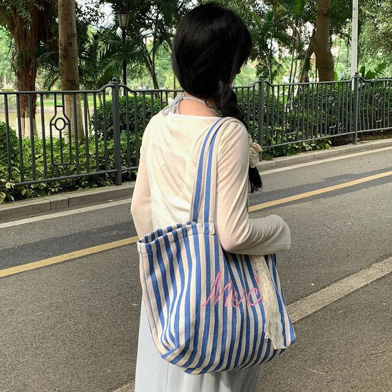 Blue striped letters printed on pink blue and white striped cotton canvas bag