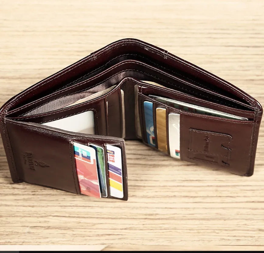 Men's brown leather bifold wallet open to show multiple card slots, a cash compartment, and a coin pocket.