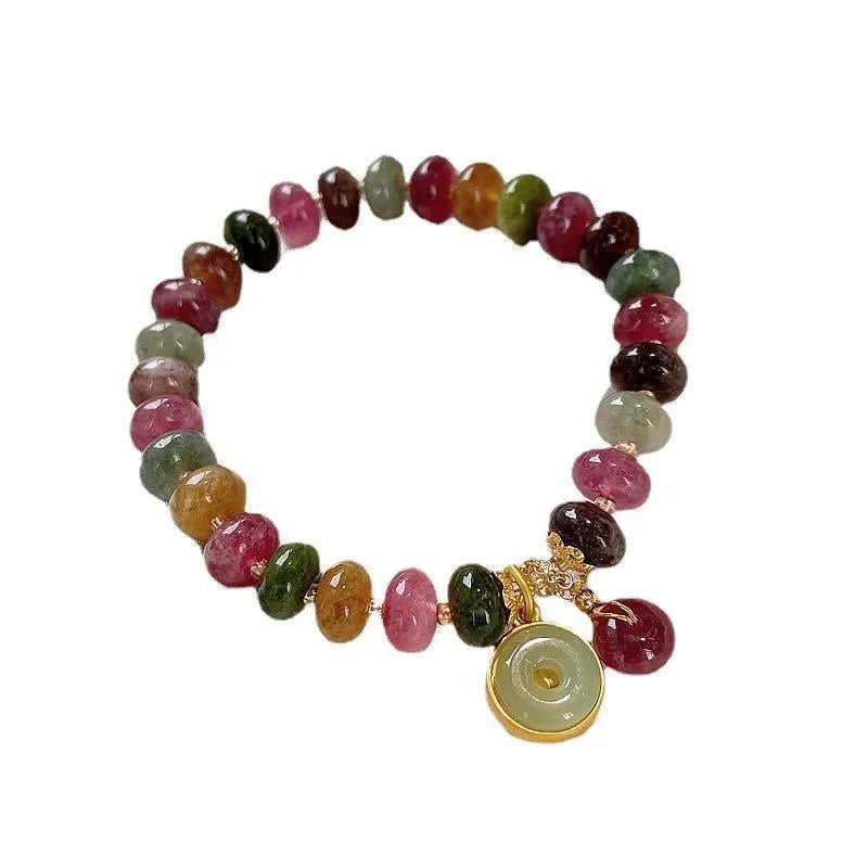 Colourful tourmaline bracelet with rabbit pendant and round abacus beads on wrist