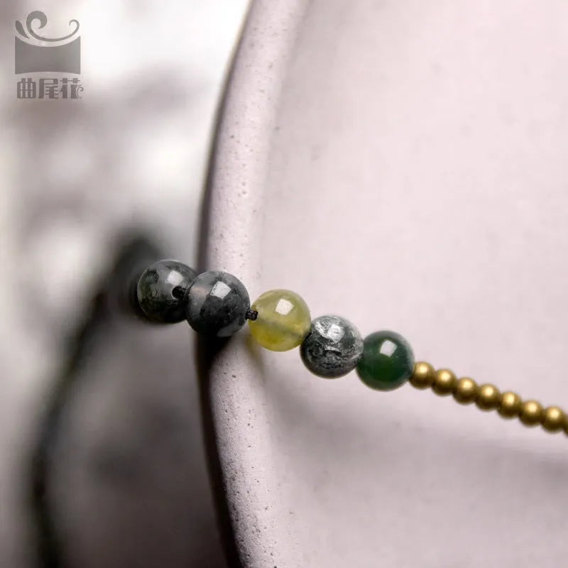 Handmade multi-layered ethnic style children's bracelet in natural crystal or stone, shown in sizes for boys and girls.