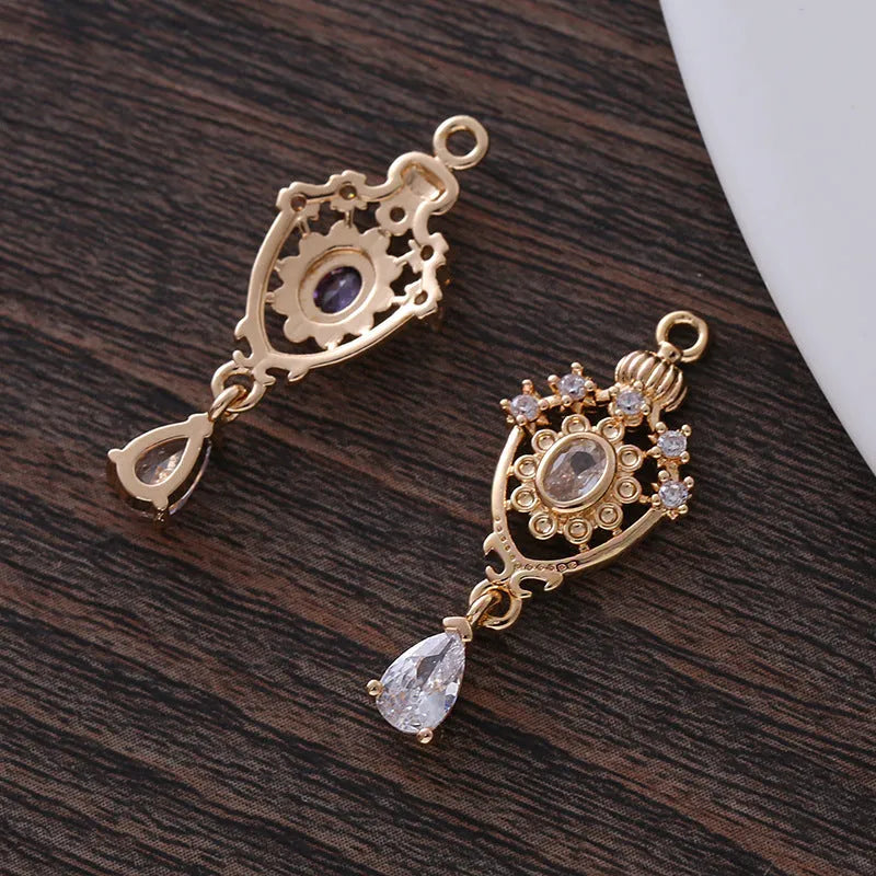 Crown motif water drop pendant with micro inlaid zircon on a copper base.