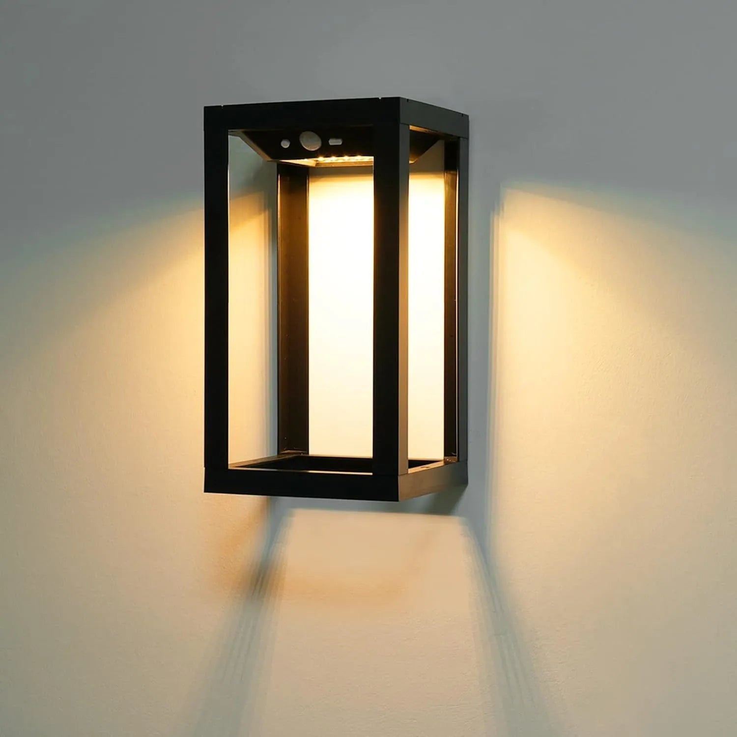 Modern Chinese style solar powered outdoor wall lamp with white plastic housing for garden courtyard lighting.
