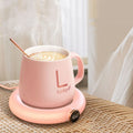 White USB coffee mug warmer coaster with dimensions 130x110x23mm on wooden desk
