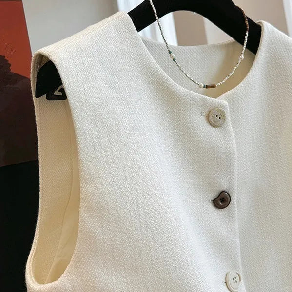 Women's sleeveless round neck vest in French bandage style, polyester fabric in milky white colour