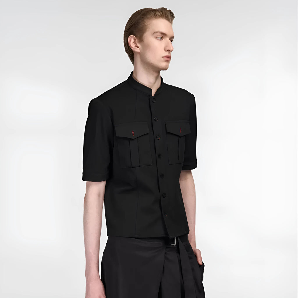 Handmade black half-sleeve shirt with a shirt collar and single-breasted front, shown in a loose fit.
