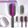 Self-cleaning air cushion hair brush in white, black gold, or black purple with ergonomic handle