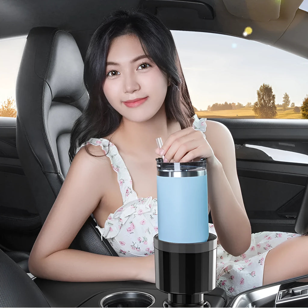 Matte black adjustable car cup holder expander for large bottles and cups on a car centre console