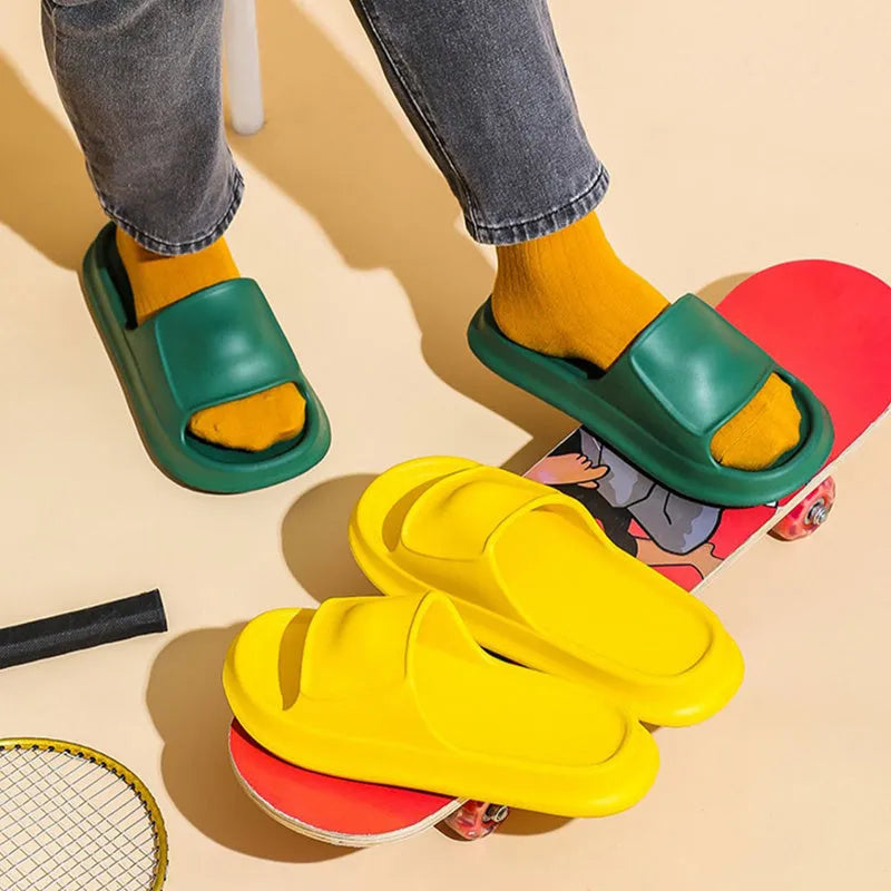 Soft EVA flip-flop slippers in multiple colours on a white background, showing thick sole and non-slip pattern.