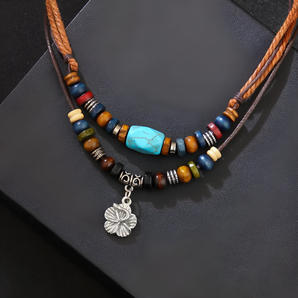 Men's retro necklace with geometric flower pendant and turquoise wooden beads on a wax rope chain.