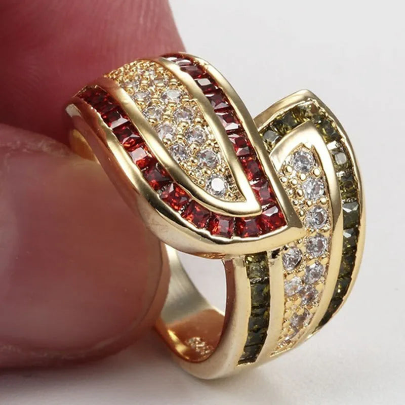 Gold-coloured women's alloy ring with a central green peridot gemstone.