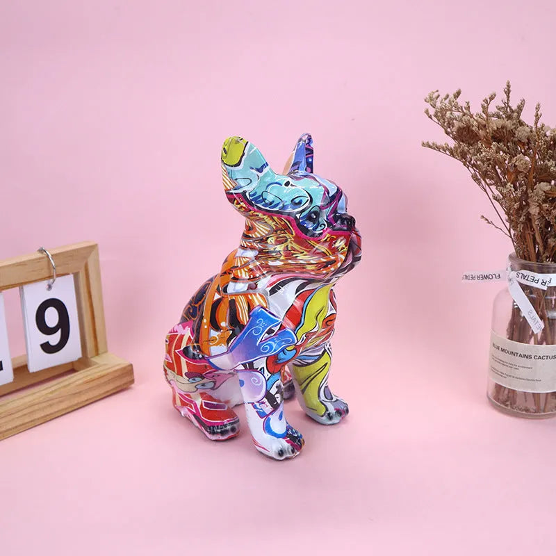Modern graffiti-colour French bulldog resin statue on a shelf.