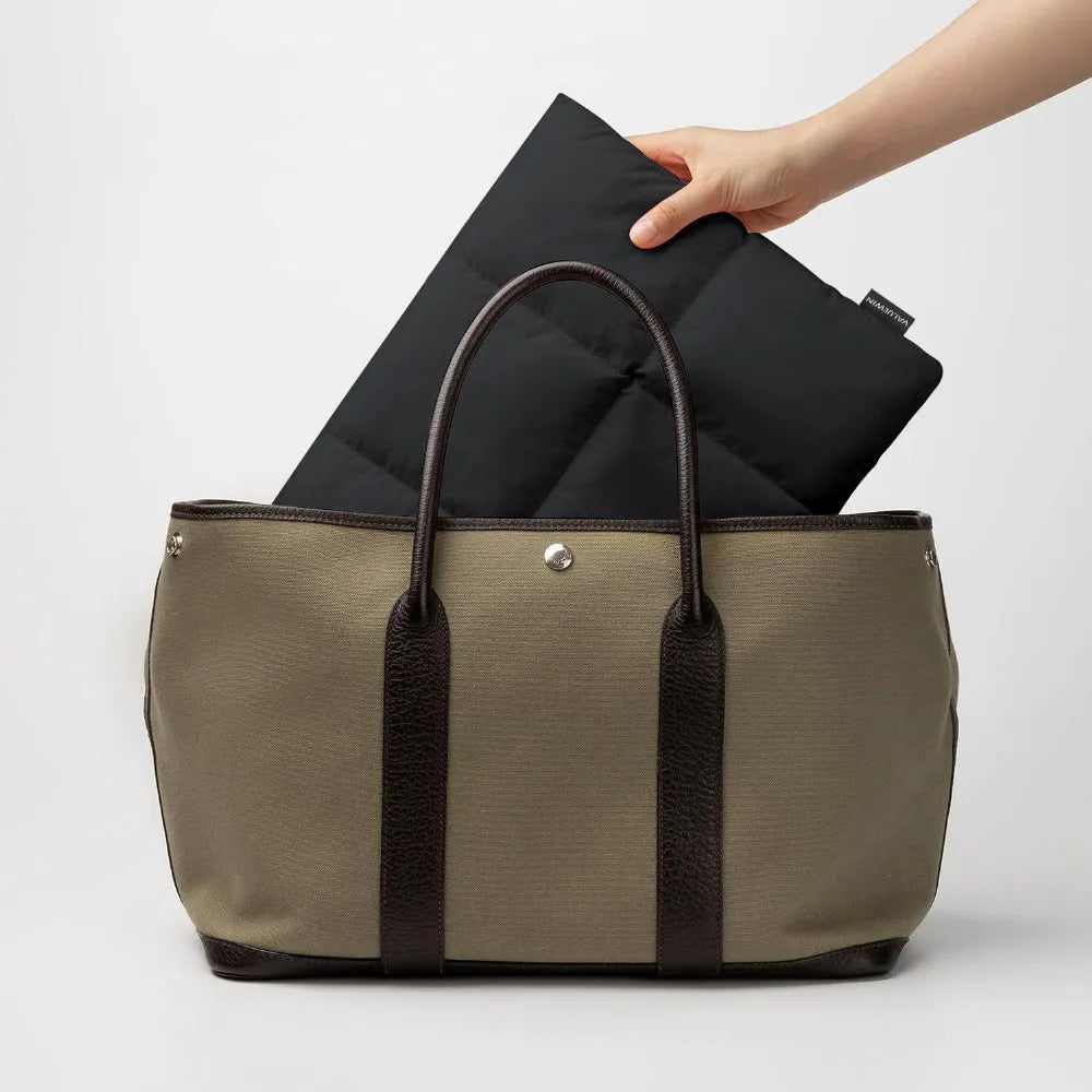 Soft black polyester laptop sleeve for a 15.6-inch laptop with stitching detail.