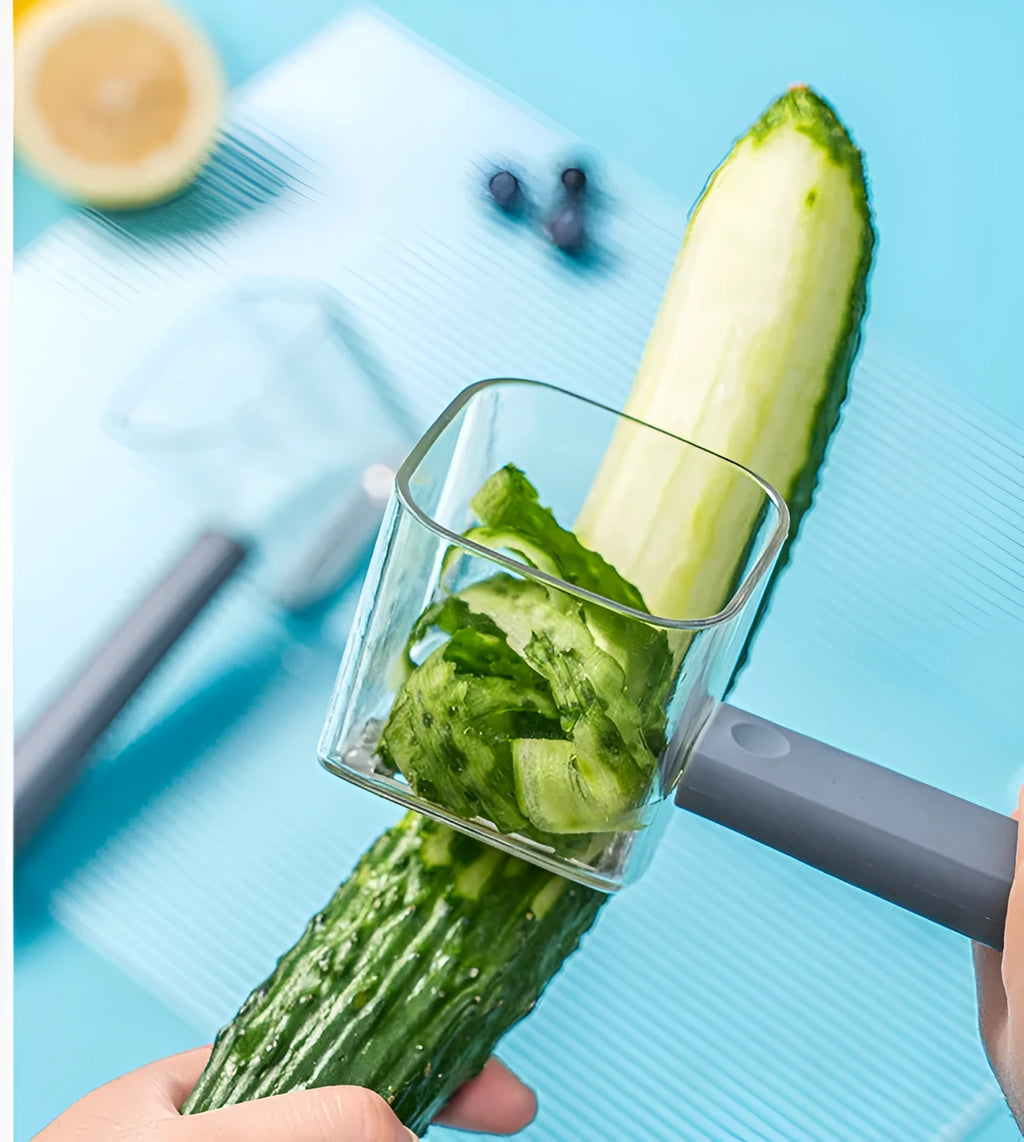Stainless steel blade peeler with coloured plastic handle in green, grey, or red.