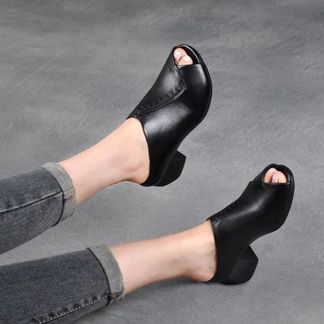 Women's black square heel peep-toe slippers with a fish mouth vamp design on a white background.