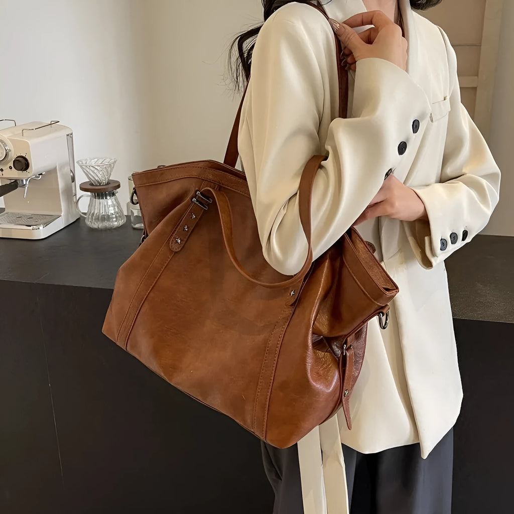 Retro soft PU leather messenger bag in black with horizontal square shape and sewing thread detail