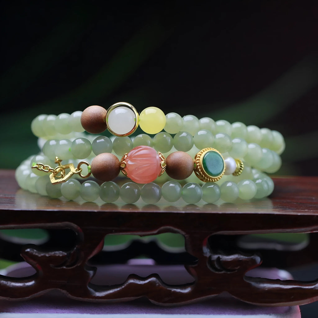 Hetian jade lotus bead necklace with white sandalwood beeswax pendant and fu character charm