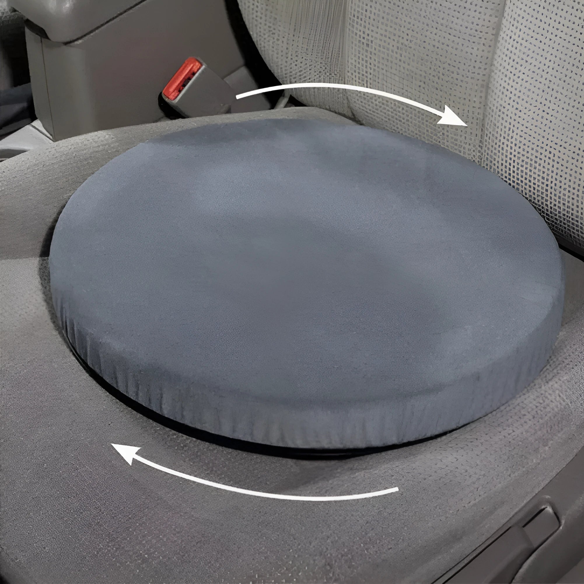 Grey rotating car seat cushion with plush fabric on a car seat, showing swivel function.