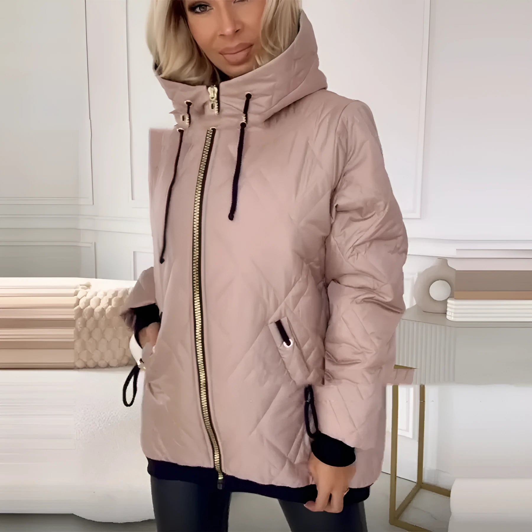 Women's pink cotton-blend hooded coat with long sleeves on a hanger