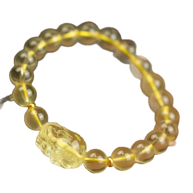 Yellow leather bracelet with an artificial crystal Citrine Pi Xiu charm in national Chinese style.