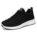 Women's flyknit running shoes in black with lace-up front and round toe design