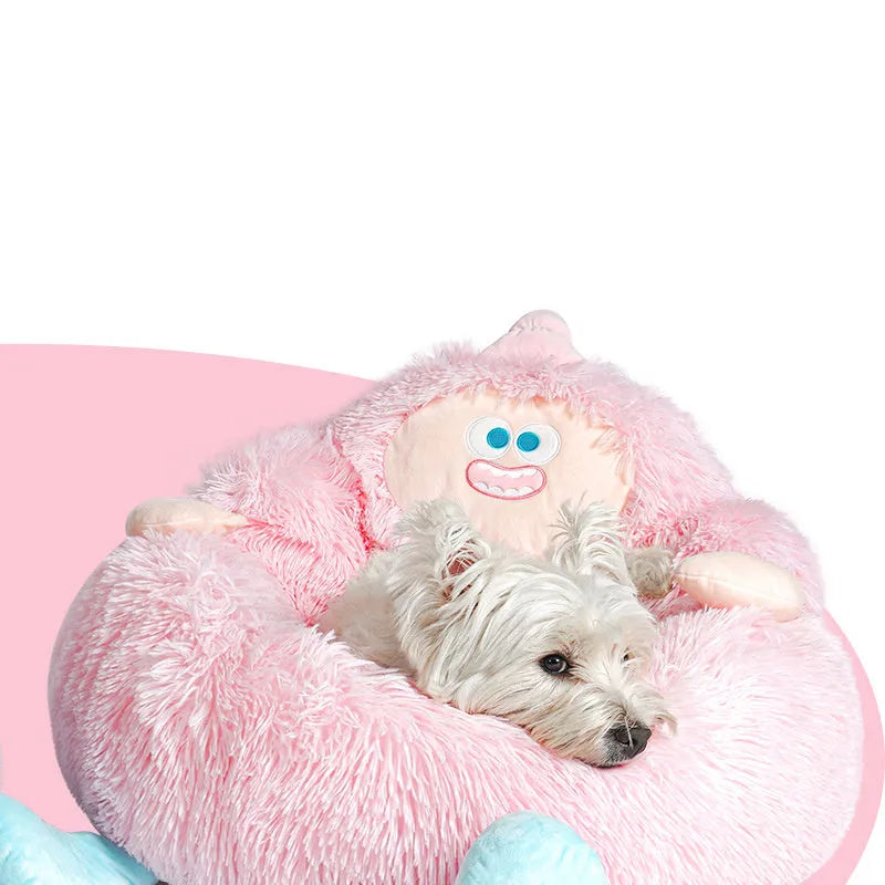 Grey plush round pet nest bed with raised rim for cats and dogs, shown in a home setting.