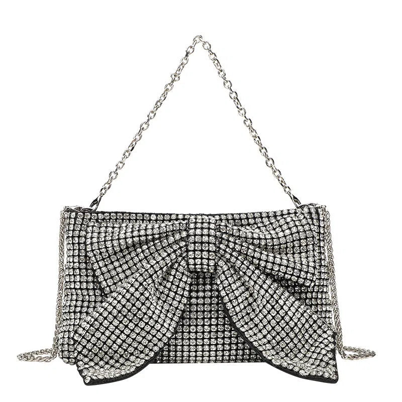 Crystal rhinestone bow crossbody bag with single shoulder chain strap in silver, AB colour silver, black, light gold, or pink.