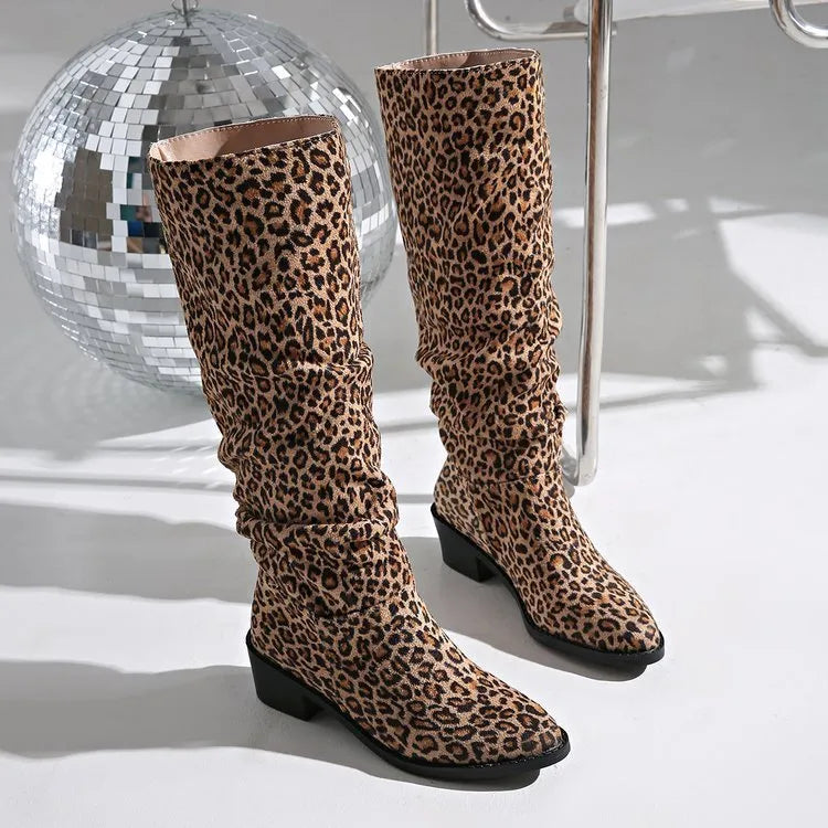 Brown women's leopard print ankle boots with a square toe and chunky mid-heel on a plain background.