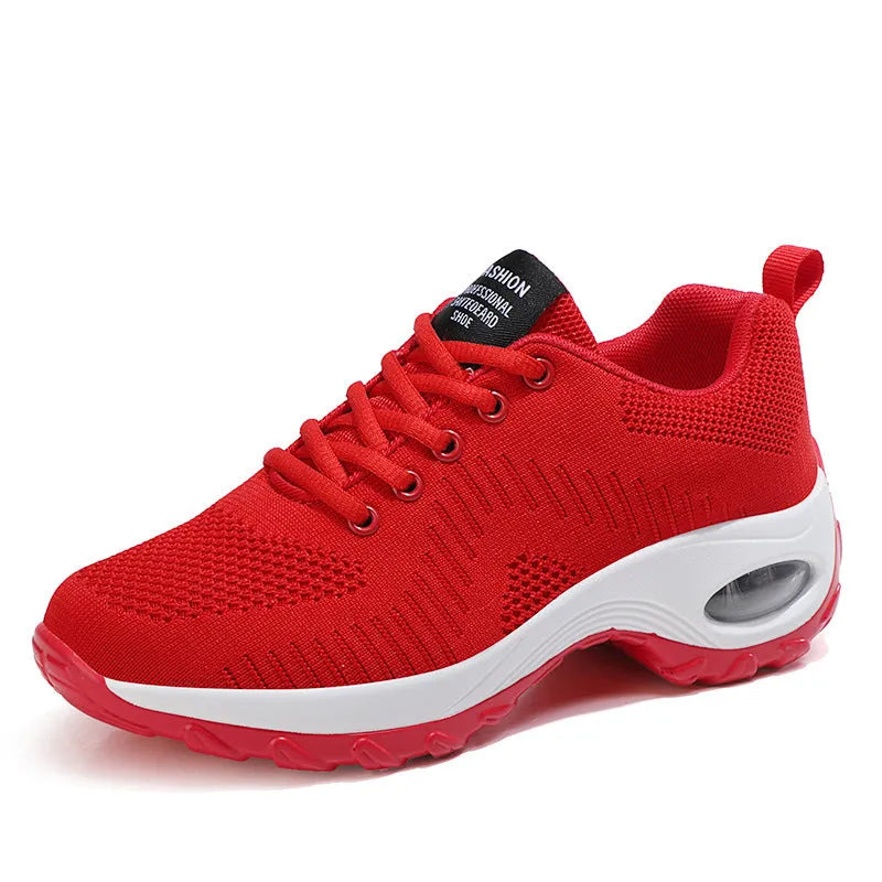 Black and red women's low-top mesh sneakers with round toe and lace-up front.
