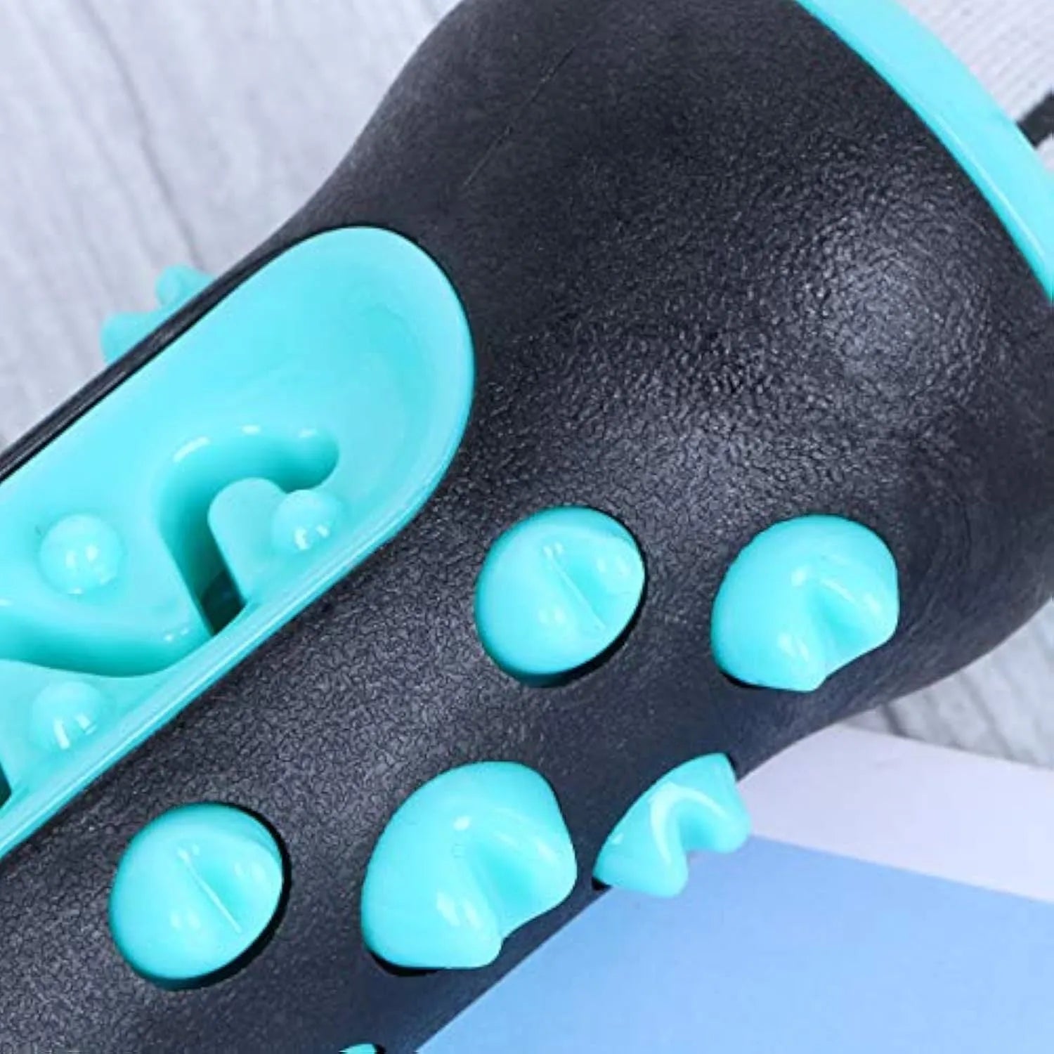 Natural rubber dog dental chew toy in blue, showing textured toothbrush design.