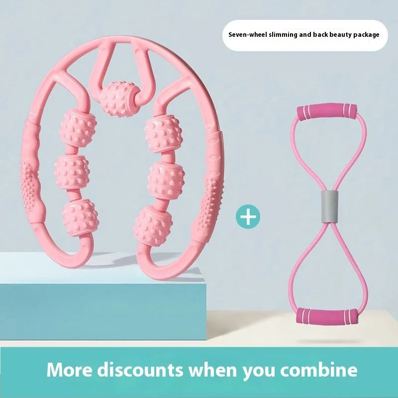 Handheld leg massager roller with multiple wheels in pink or purple on a table.