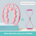 Handheld leg massager roller with multiple wheels in pink or purple on a table.