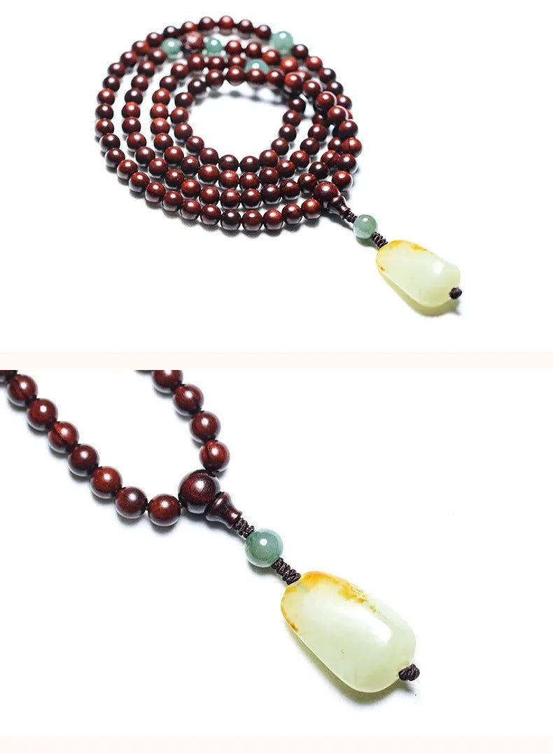 Rosewood bead bracelet with 108 beads and a carved green Hotian jade pendant.