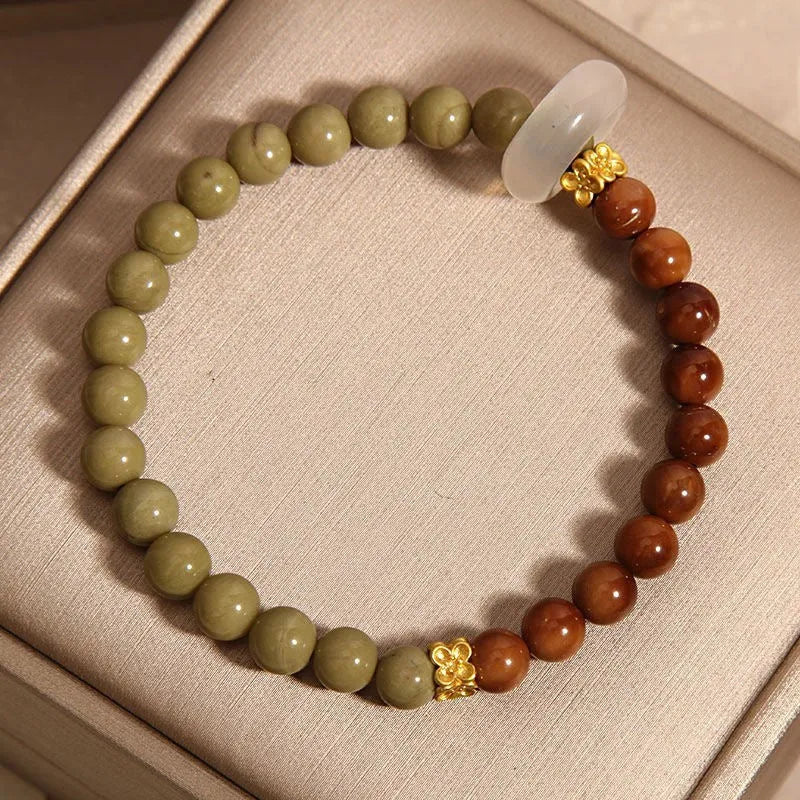 Green gradient Chinese style bracelet with crown and diamond motifs on mixed materials