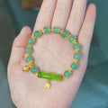 Retro glass flower bracelet with ruyi design in electroplated finish showing beige, green, light green, and white colour options