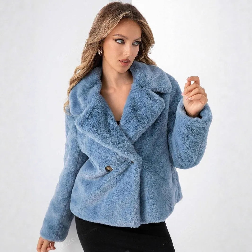Women's short loose faux fur coat in rose red colour on a hanger.