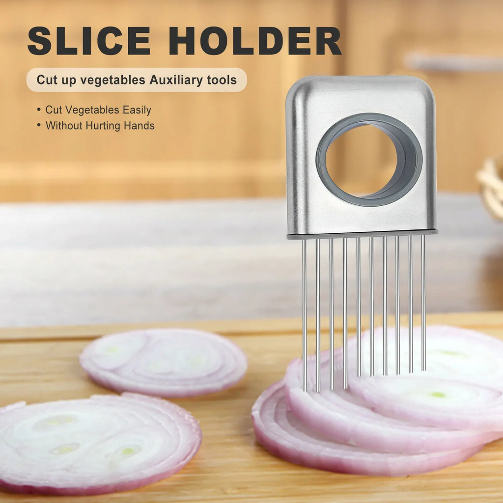 Stainless steel onion holder with sharp prongs and a red finger guard on a kitchen counter.