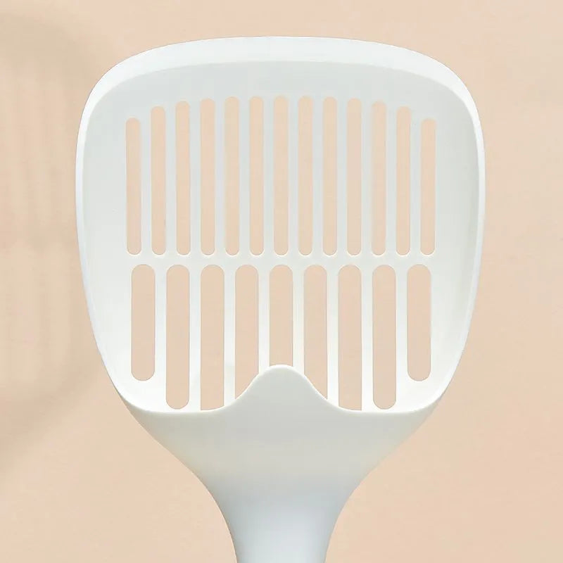 White plastic cat litter scoop with an attached rectangular base.
