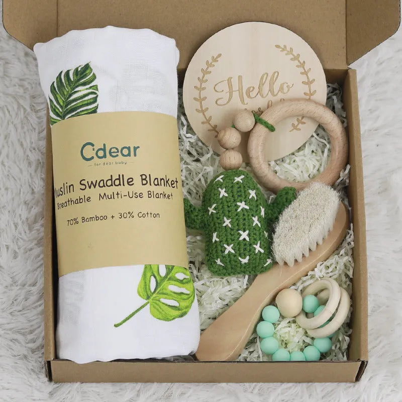 Baby teething gift set with bamboo fibre blanket and wooden teethers in corrugated box