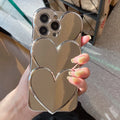 Soft TPU iPhone case with a silver electroplated love design on the back, shown next to a matching bracelet.