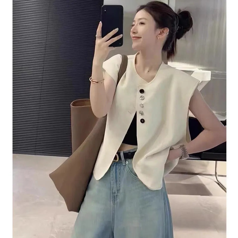 Women's loose fit polyester sleeveless vest in milky white with a visible pocket detail.