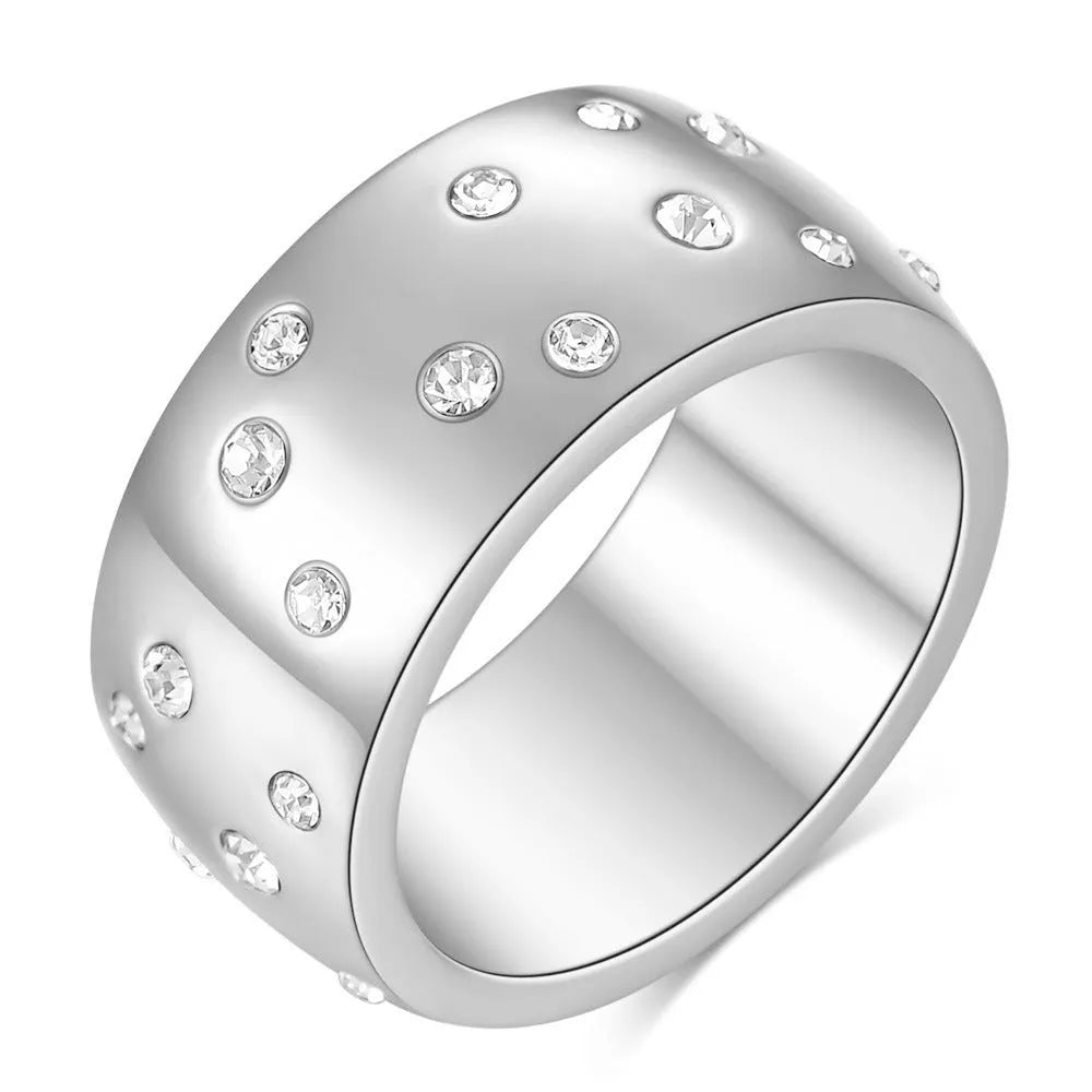 Geometric titanium steel couple ring with diamond treatment in rose gold finish on a size chart.