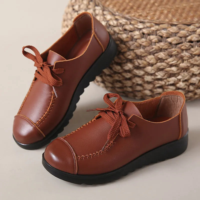 Women's black flat work shoes with microfiber upper, round toe, front lacing and anti-slip polyurethane sole